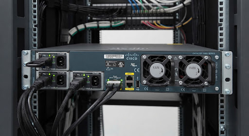 Rear panel view of Cisco 9300 enterprise switch showing dual redundant hot-swappable 715W AC platinum power supply modules and dual cooling fan assemblies